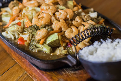 High angle view of chopped vegetables in bowl on table