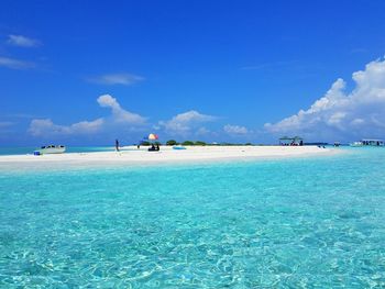 Scenic view of sea against blue sky