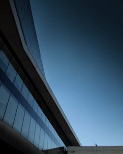 Low angle view of modern building against clear blue sky