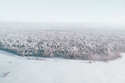 Scenic view of land against sky during winter