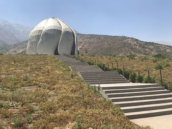 Built structure on mountain against sky