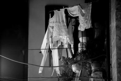 Midsection of woman standing against building
