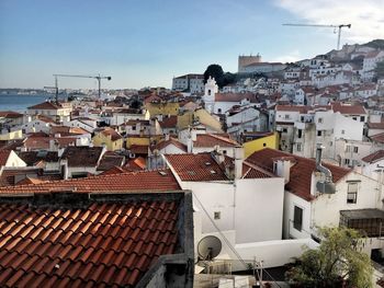 Houses in city against sky