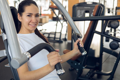 Side view of man exercising in gym