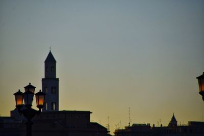 Buildings against sky at dusk