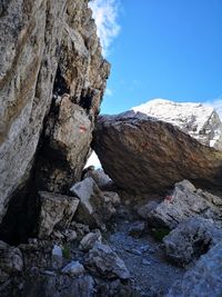 Low angle view of rock formation against sky