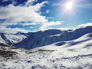 Scenic view of snowcapped mountains against sky