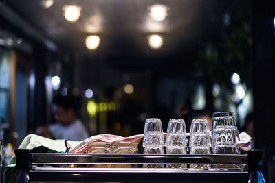 Glass of bottles on table in restaurant