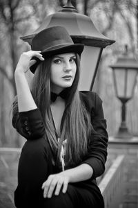 Portrait of young woman wearing hat