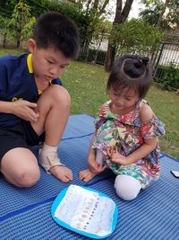 Cute girl sitting on playing