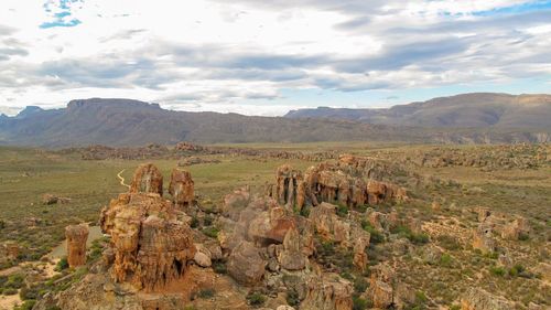 Panoramic view of landscape against cloudy sky