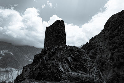 Low angle view of rock formations against sky