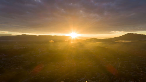 Scenic view of landscape against sky during sunset