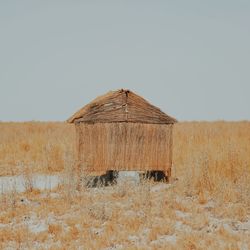 Hut on field against clear sky at atacama desert