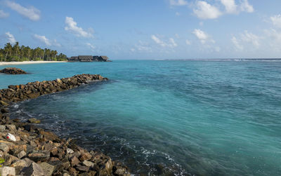 Aqua sea against a blue sky in  reethi rah resort, maldives.