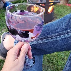 Midsection of woman holding drink