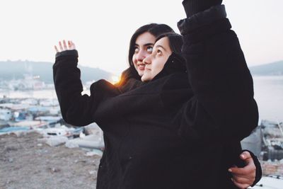 Young women waving