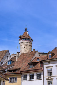 Low angle view of building against clear blue sky