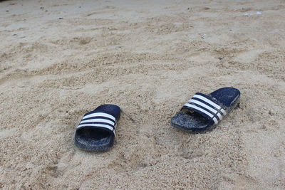 High angle view of shoes on sand