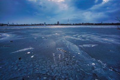 Scenic view of frozen lake against sky