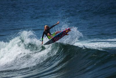 People surfing in sea
