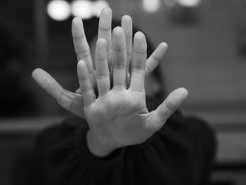 Close-up of human hand against blurred background