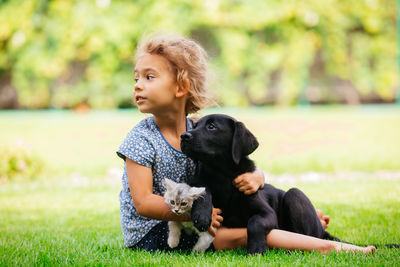 Woman with dog on grass