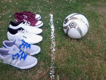 High angle view of shoes on field