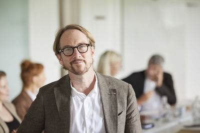 Portrait of businessman looking at camera