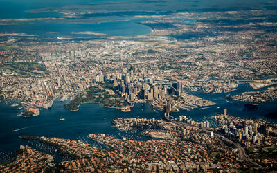 High angle view of city by sea