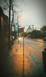 Road passing through city at night