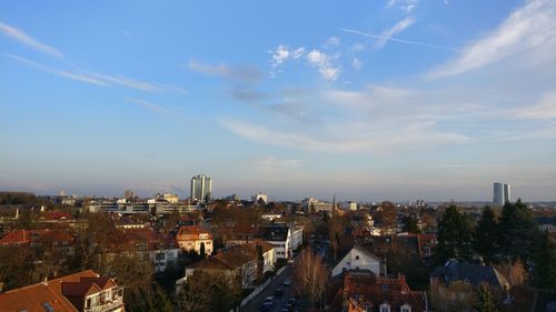 Aerial view of town against sky