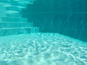 Steps in turquoise swimming pool