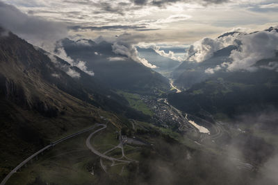 Aerial view of mountain road against cloudy sky