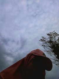 Low angle view of person against sky
