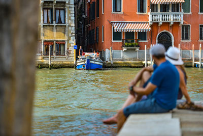 Men in boat on canal