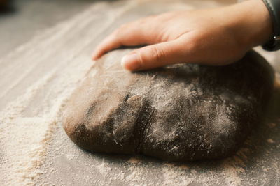 Cropped hand of person preparing food