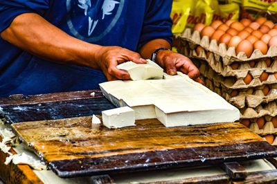 Close-up of man preparing food