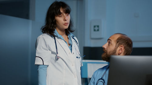 Young woman standing in hospital