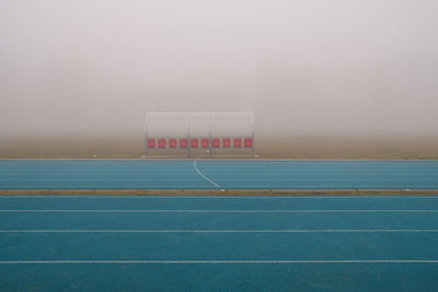 Scenic view of soccer field against  fog