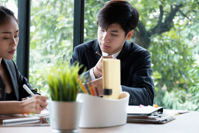 Young couple sitting on table