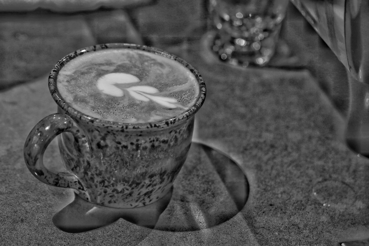 CLOSE-UP OF COFFEE WITH DRINK ON TABLE