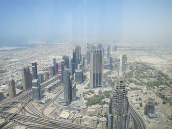 High angle view of city buildings against sky