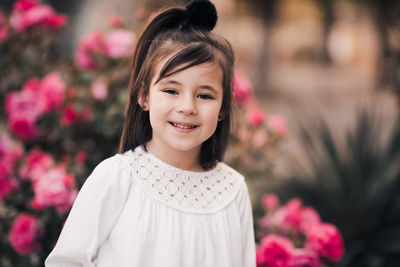 Funny kid girl 4-5 year old posing over nature background closeup. looking at camera. summer season.