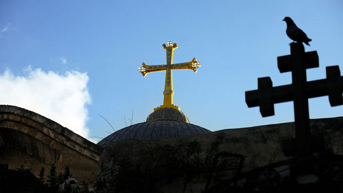 Low angle view of statue against sky