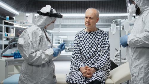 Portrait of female friends standing in clinic
