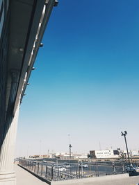 Low angle view of bridge against buildings in city