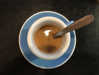 High angle view of coffee cup on table