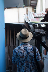 Rear view of man wearing hat