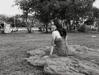 Woman sitting on field